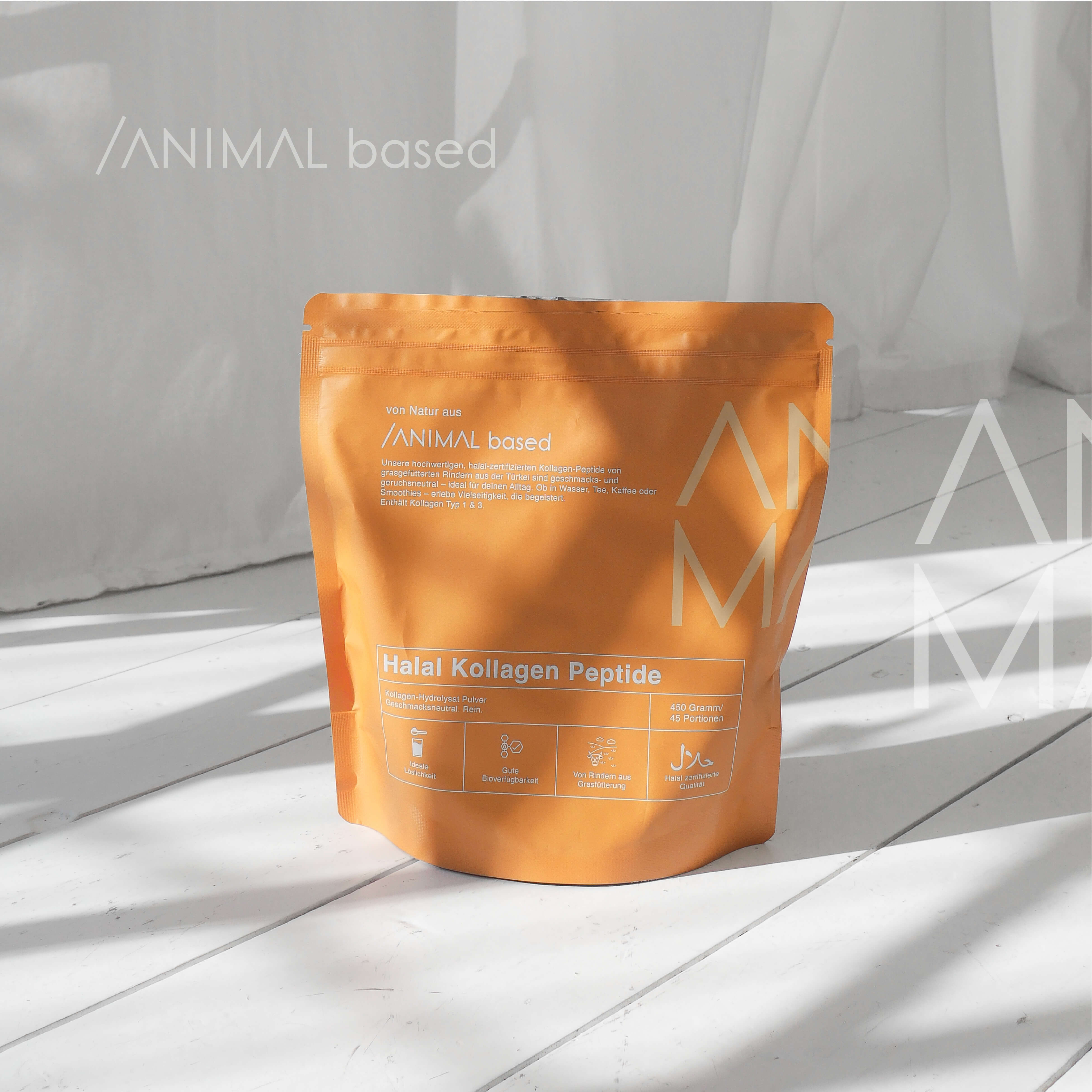 Close-up of a single green leaf against a white background.