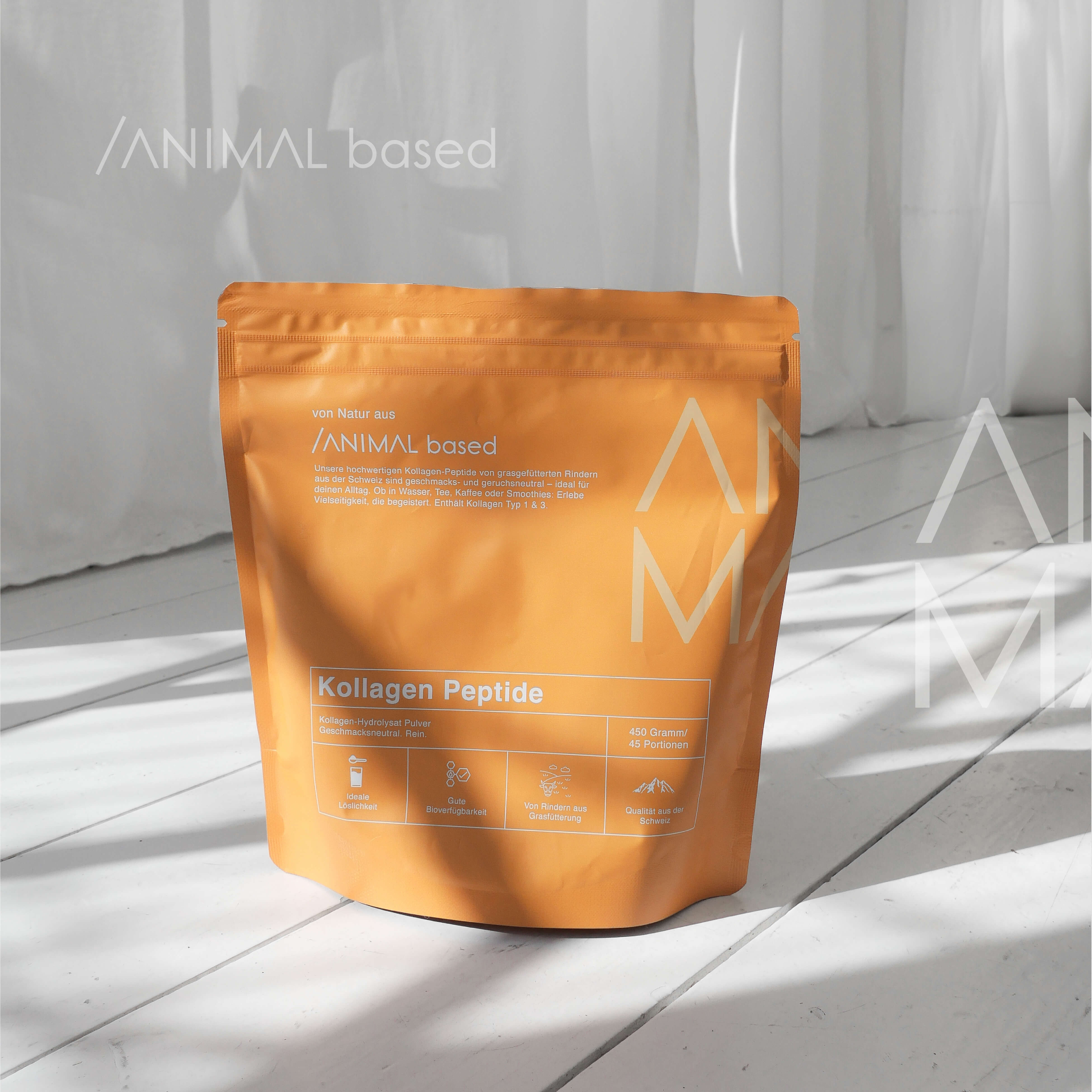 Close-up of a single green leaf against a white background.